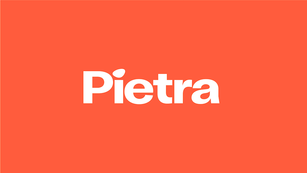 White logo on orange-red background